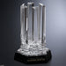 Six beveled pillars stand tall on a mirrored black crystal base
